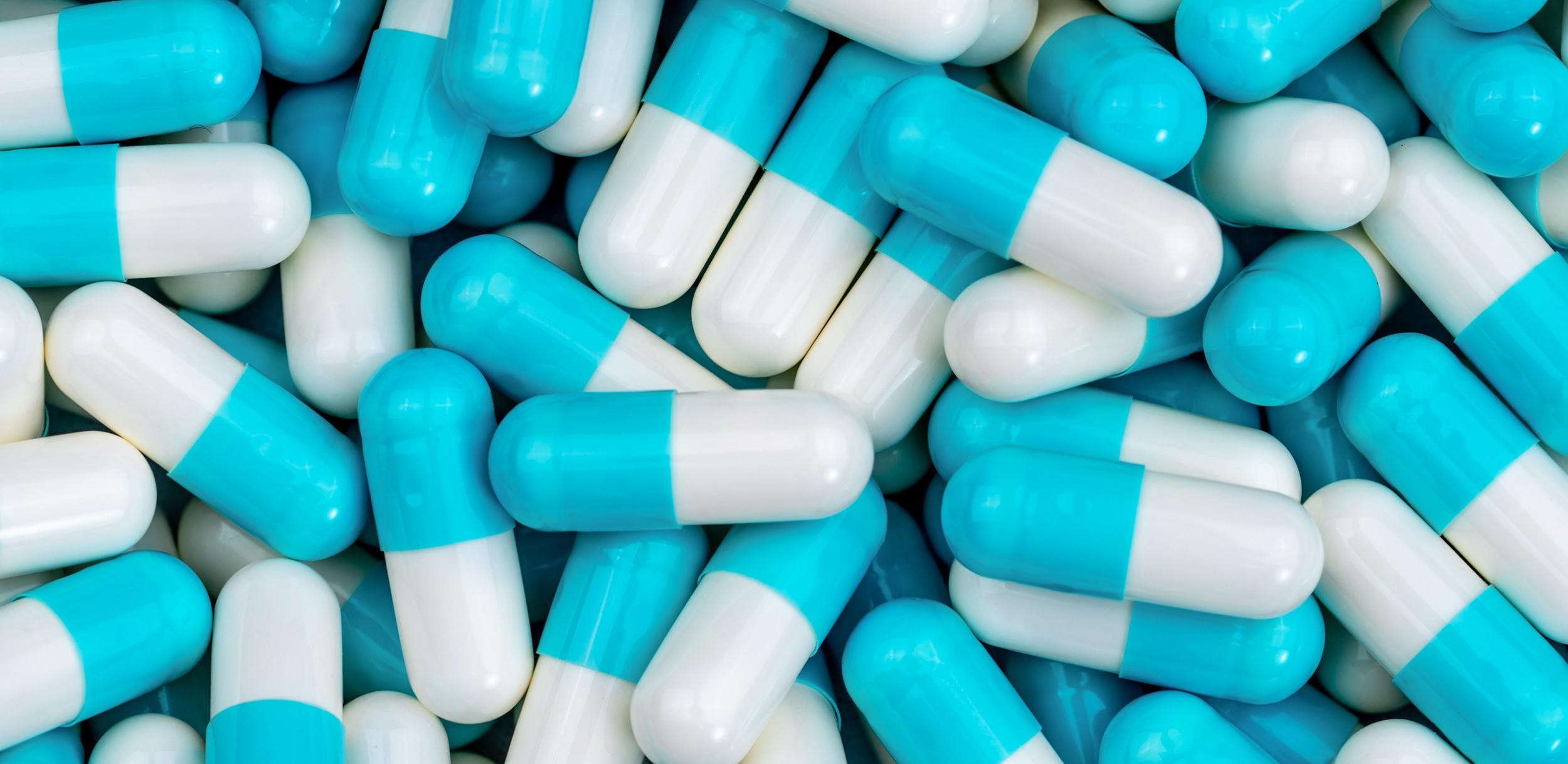 close up of some blue and white tablets