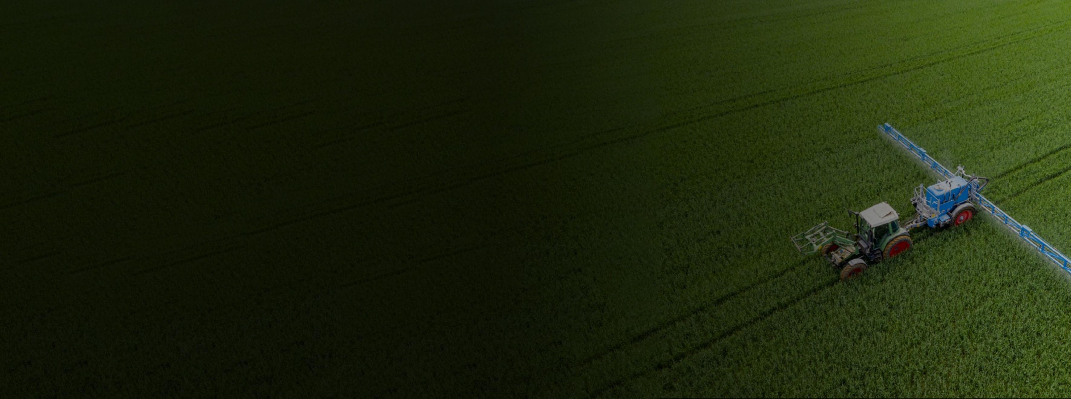Aerial shot of a tractor in a field