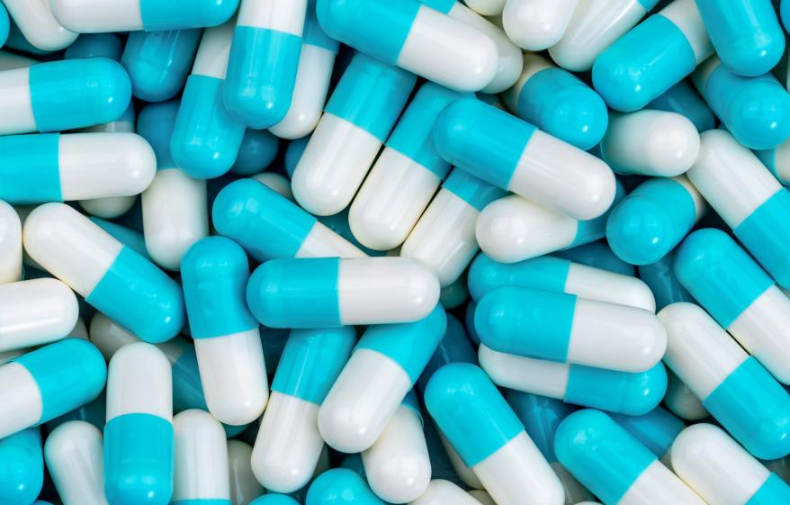 close up of some blue and white tablets