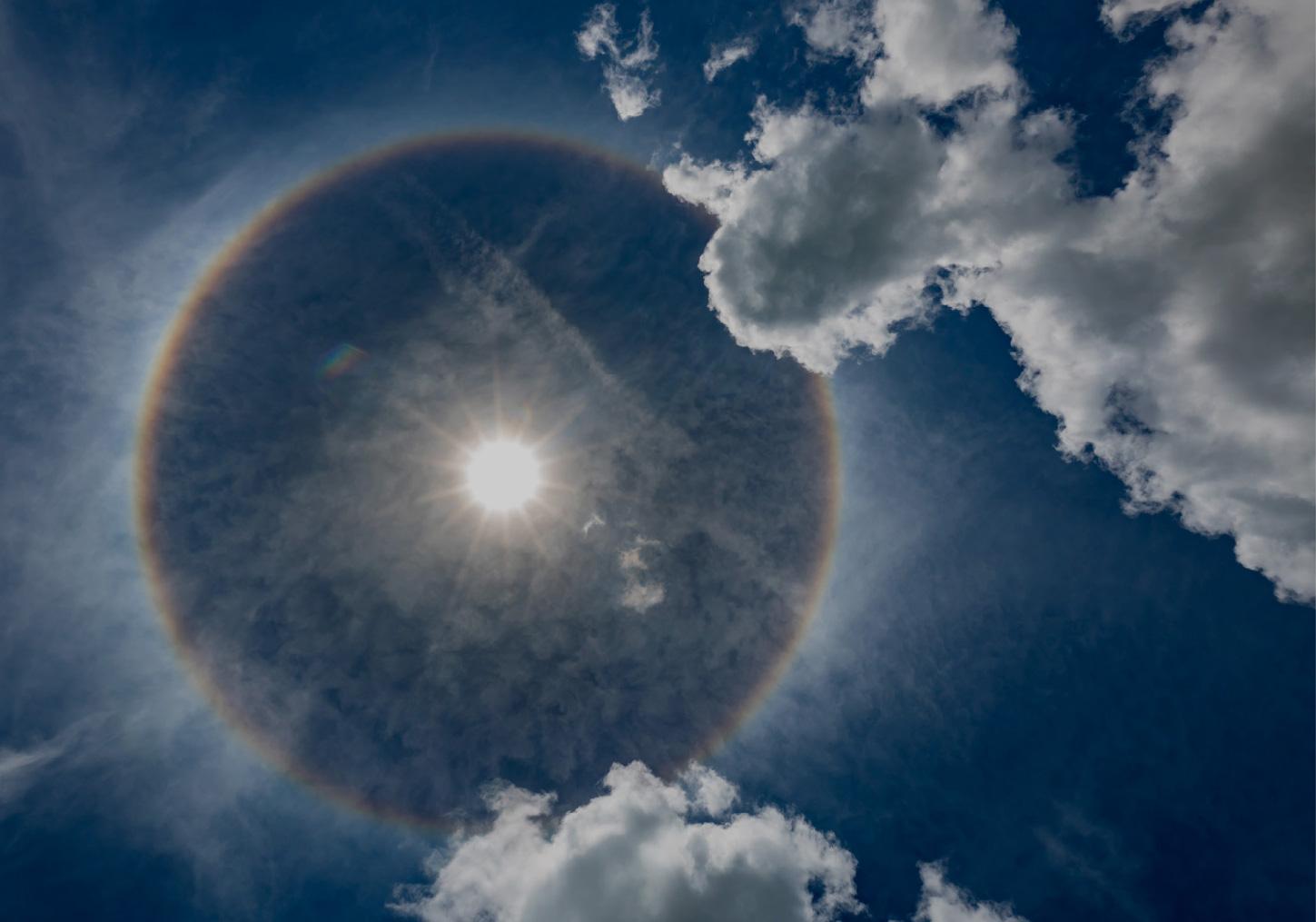The sun in a cloudy sky